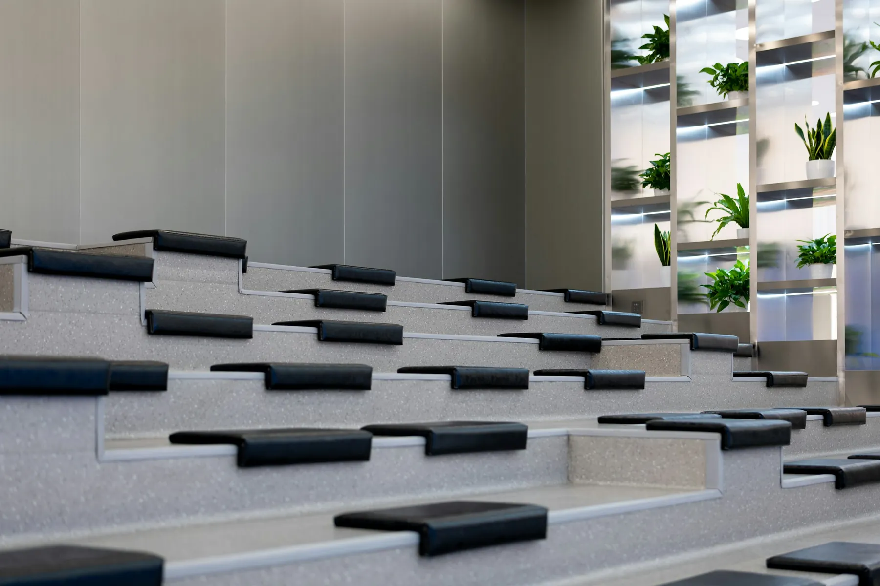Tiered seating and plants in an open conference space in Shanghai